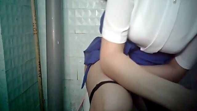 Hot and busty white lady in dress pissing in the toilet room