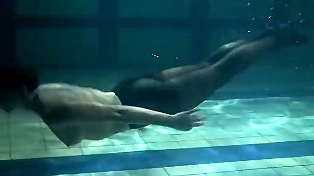 Clothed underwater beauty Bulava Lozhkova swimming naked