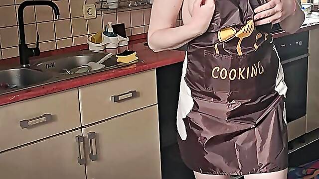 Sexy wife in the kitchen cooking naked