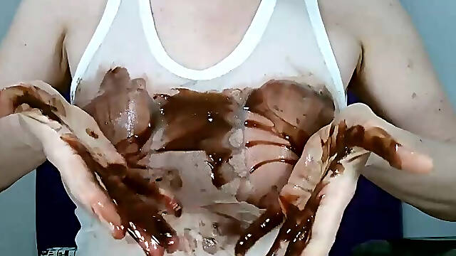Wetting boobs, tities and nipples with chocolate